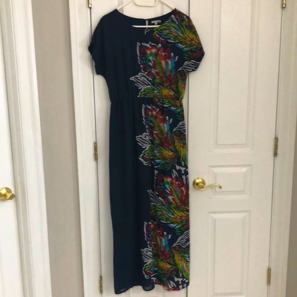 Maxi dress with offset floral print. Size L, navy blue button closure at back.
